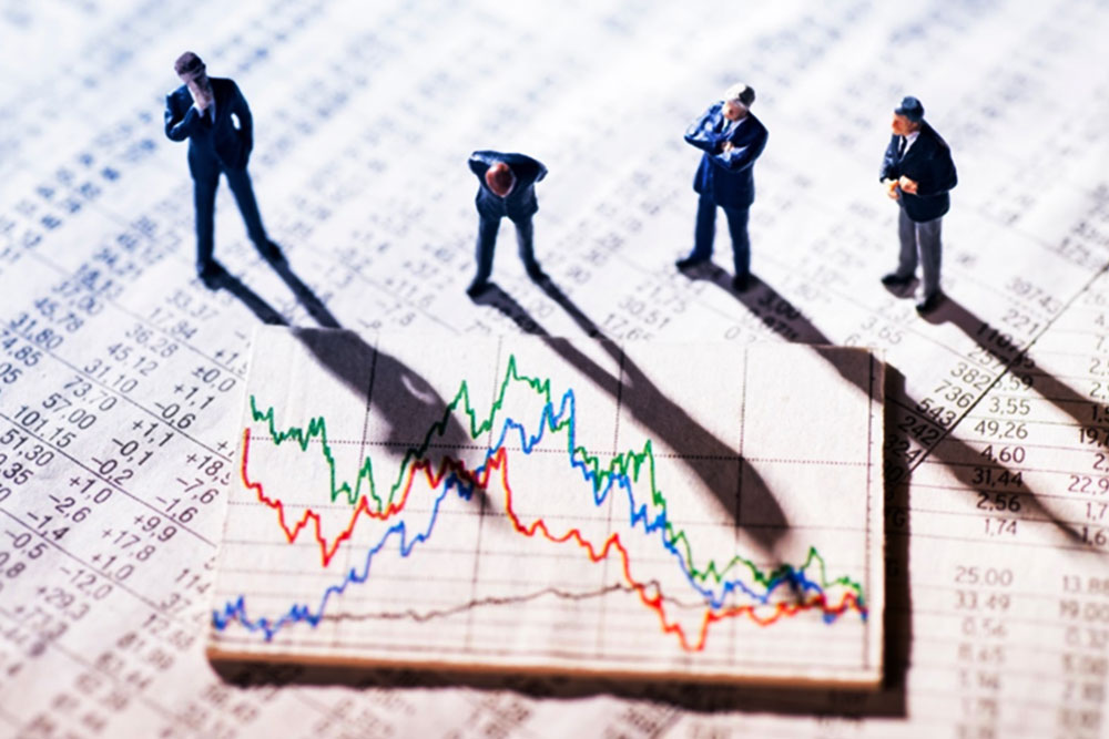 figures scanning a market sheet 